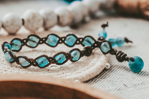 Aqua Ghana glass beads braided on leather for a bracelet