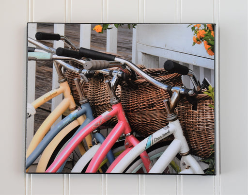 canvas photo of 4 bike handlebars with baskets
