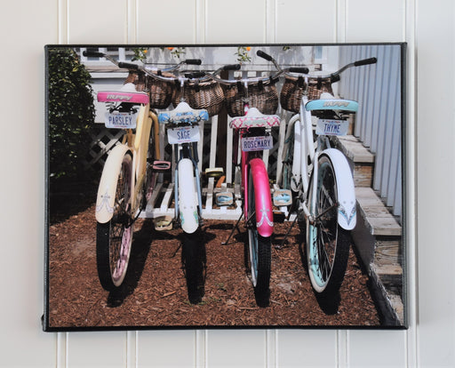 4 parked bikes with license plates that say parsley, sage, rosemary thyme canvas photo